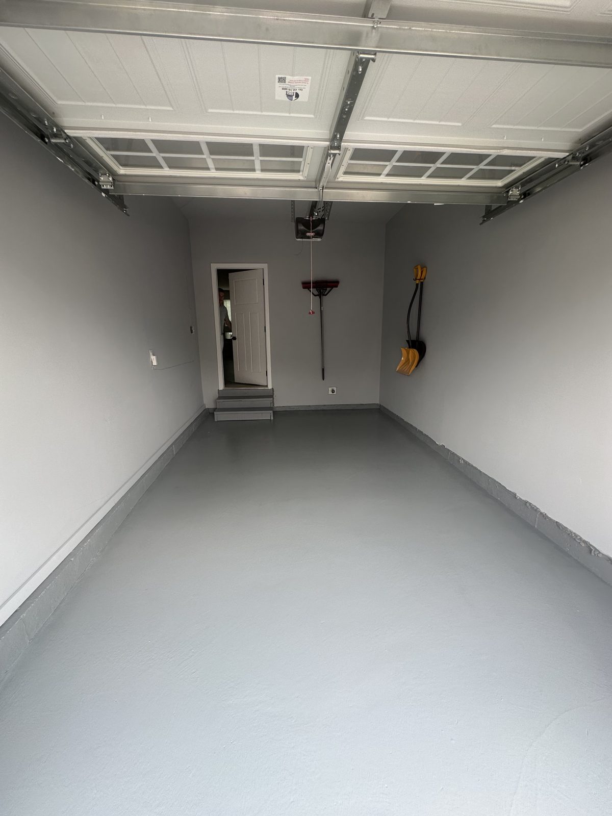 Garage with freshly painted gray floor