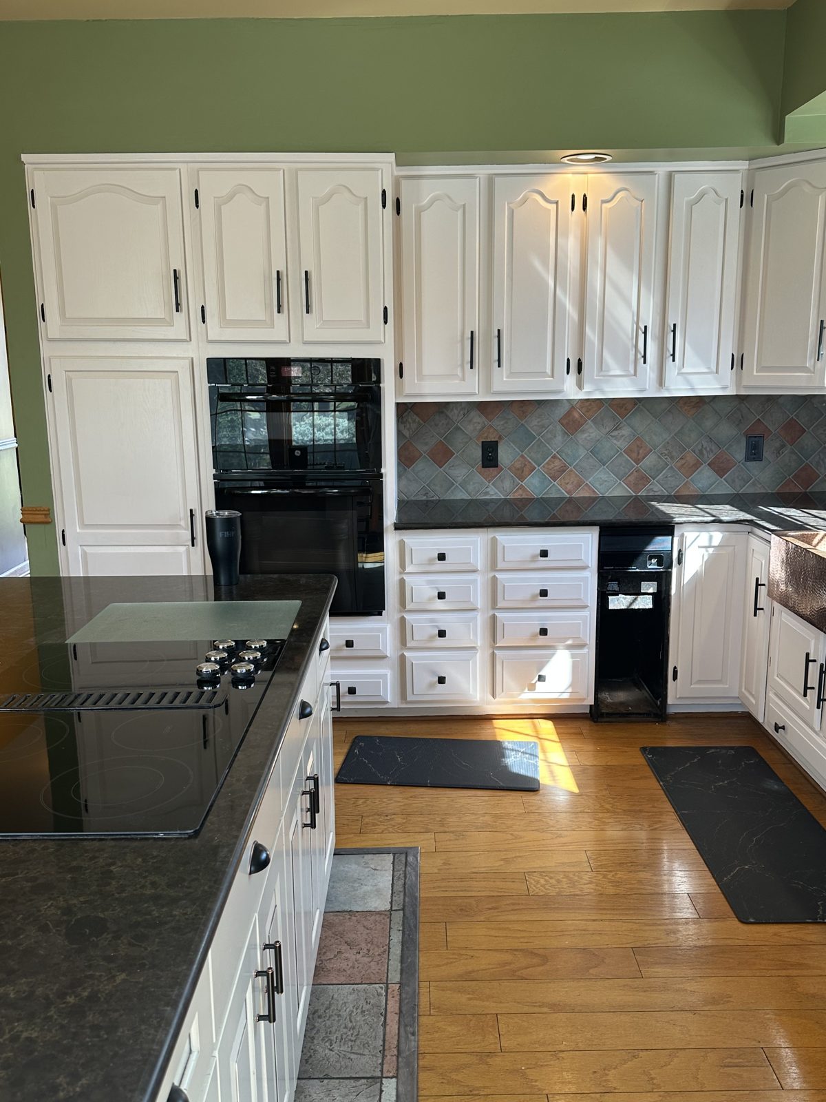 Kitchen with white painted cabinets