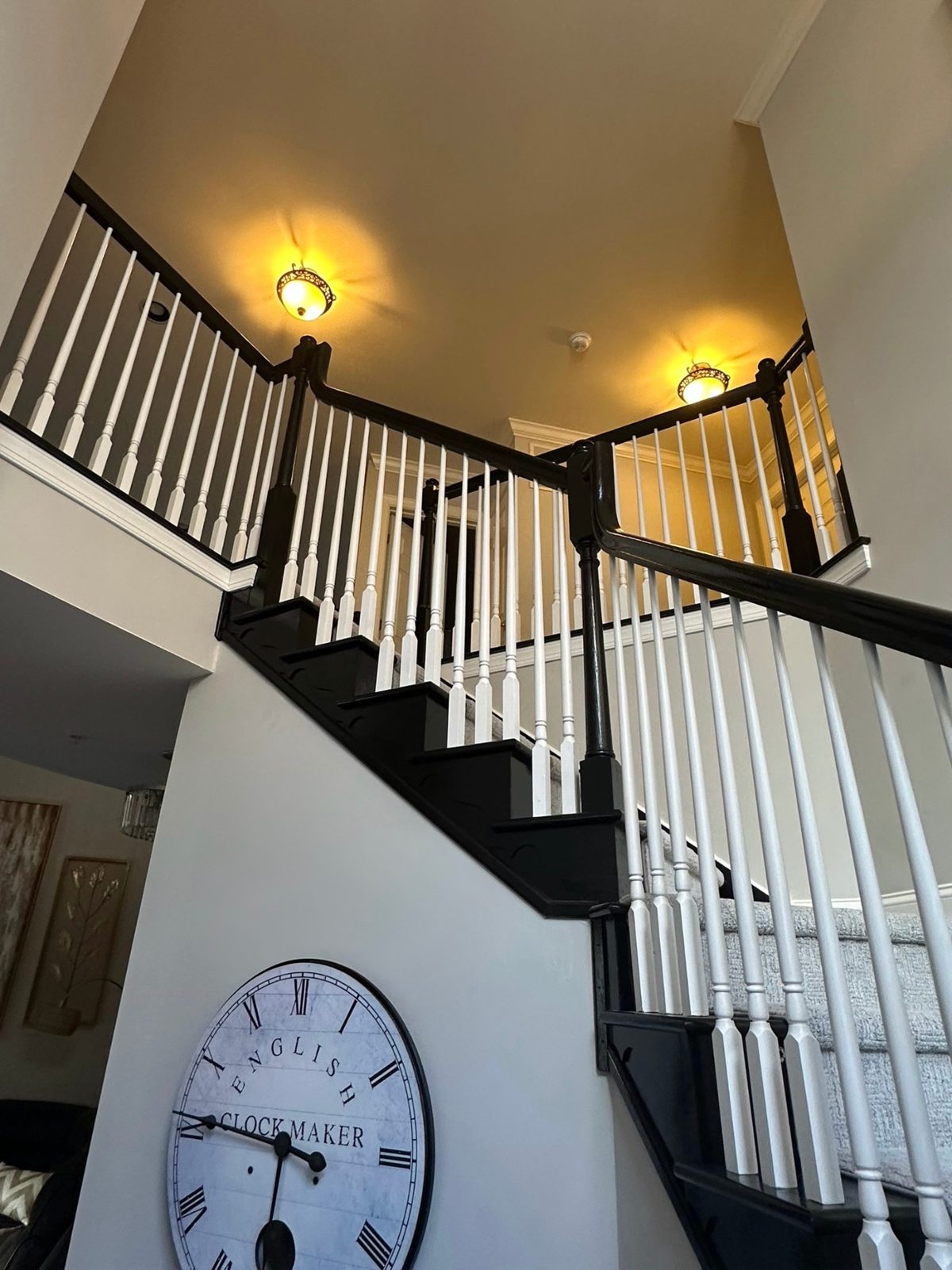 Staircase with white spindles and dark treads