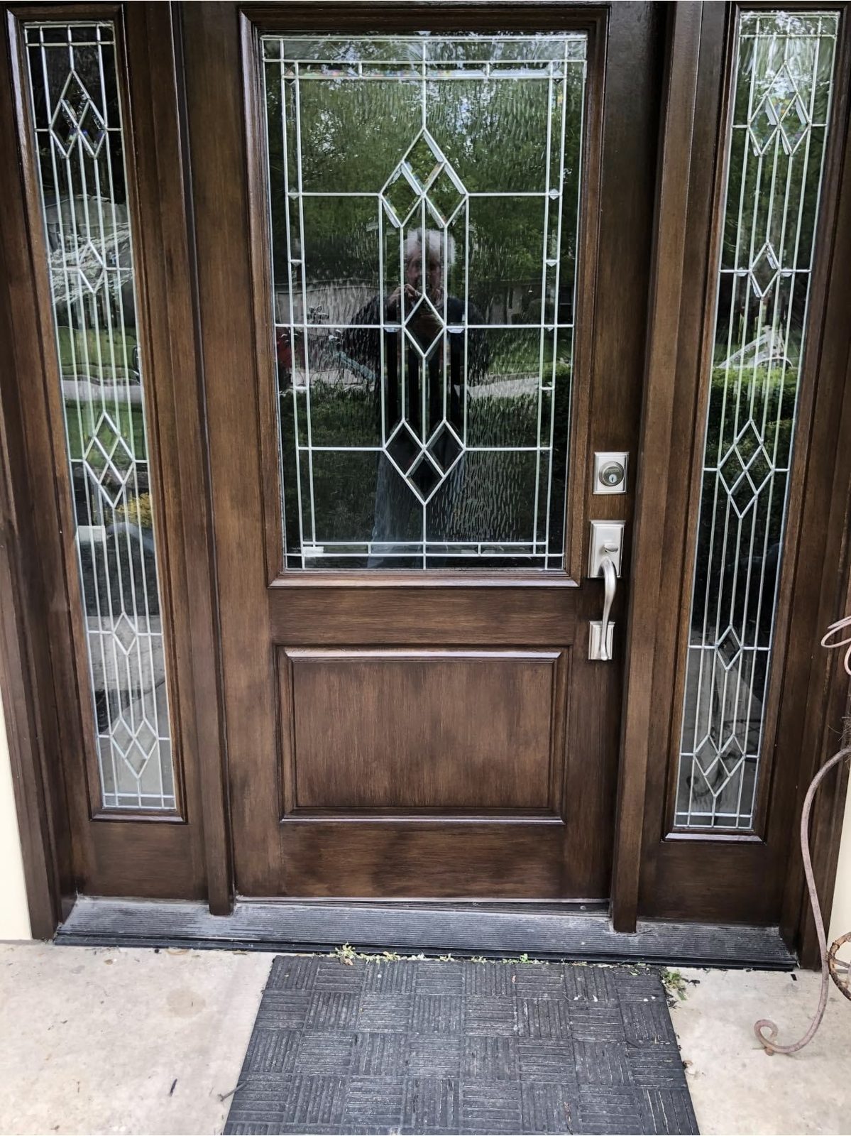 Wood front door with leaded glass panels